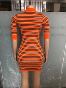 Detailed back view of a slim-fit knit dress with orange, brown, and white stripes
