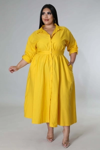 Detailed view of bright yellow plus size shirt dress with button-up front and a waist tie