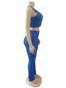 Detail view of blue knit two-piece set featuring cutout texture and hollow-out design
