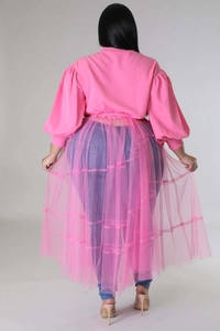 Rear view of plus size pink puff sleeve top with a layered sheer tulle mesh wrap skirt