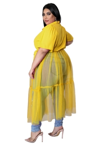 Detail of plus size yellow chiffon top with sheer mesh layering and split design