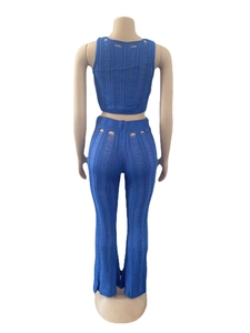 Rear view of a royal blue hollow knit two-piece set showing detailed back cut-outs