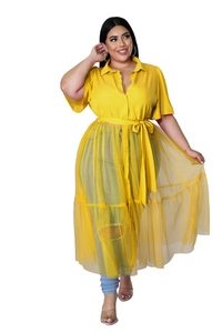 Detail of plus size yellow shirt dress featuring layered sheer mesh hem and tie waist belt