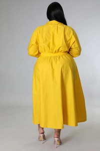 Back view of a yellow long-sleeved plus size shirt dress with elastic waist design