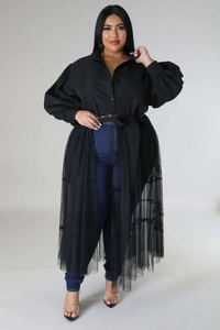 Detail of plus size black shirt dress featuring puff sleeves and sheer mesh patchwork design
