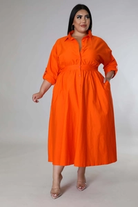 Detail of vibrant orange plus size shirt dress with lapel collar and button closure