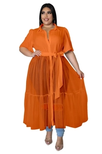 Detail of plus size orange chiffon dress featuring a mesh hem and adjustable waist tie