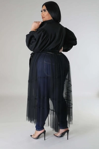 Detailed back view of plus size black mesh overlay dress with stylish puff sleeves