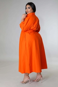 Macro detail of high-quality orange plus size long sleeve shirt dress with lapel and waist design
