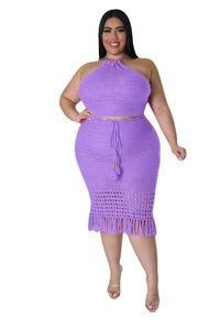 Detail of purple crochet two-piece set featuring hollow knit texture and fringe tassels