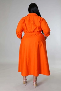 Rear view of bright orange plus size long sleeve shirt dress with elastic waist design
