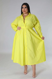 Detail of plus size bright yellow shirt dress showing waist elastic and button closure