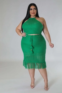 Detail view of vibrant grass green crochet two-piece set featuring tassel knit texture