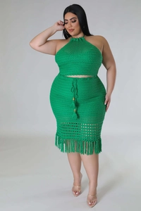 Detail of bright green crochet two-piece set featuring halter top and fringed mesh skirt