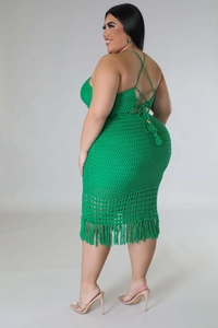 Detail of green crochet knit set featuring halter back ties and fringe hem texture