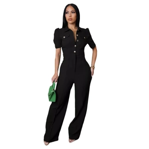 Detail of black short sleeve jumpsuit featuring lapel collar and metal buttons design