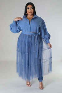 Detail of blue puff sleeve shirt with sheer mesh overlay and belted waist design