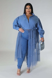 Detail view of plus-size blue tunic dress with sheer mesh layers and puff sleeves