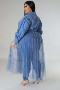 Detail of plus size blue layered outfit featuring mesh dress and puffy sleeve shirt