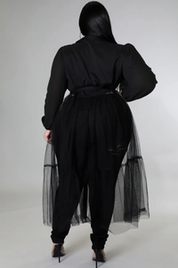 Rear view detail of plus size black tunic with sheer mesh overlay and cinched waist design