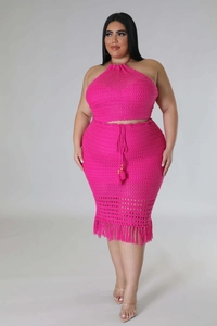 Detail of rose red crochet two-piece set with halter top and fringed midi skirt