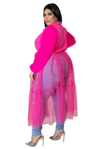 Detail view of plus size fuchsia chiffon mesh tunic top paired with slim blue denim jeans