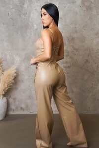 Detailed back view of camel faux leather wide-leg jumpsuit with slim straps and zipper