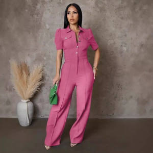 Detail of rose red short sleeve jumpsuit with puff sleeves and metal button closure