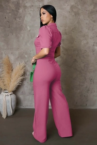 Rear view of pink short-sleeve jumpsuit with bubble sleeves and high waist cinching