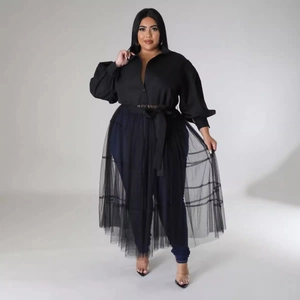 Plus size black dress with puff sleeves and layered mesh panels in a modern stylish design