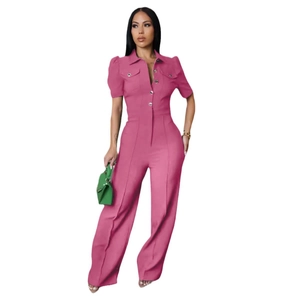 Detail shot of pink short sleeve jumpsuit showing lapel collar and single-breasted buttons