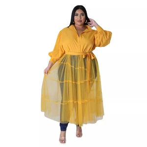 Plus size two-piece outfit featuring yellow puff sleeve shirt and layered mesh skirt set