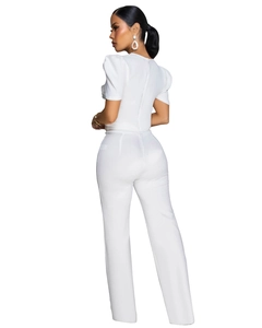 Detail of white wide-leg jumpsuit with short puff sleeves and back zipper closure