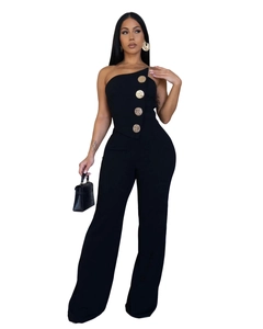 Detail of black one-shoulder jumpsuit with luxury gold decorative buttons on front