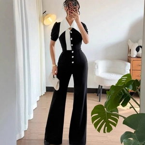 Short sleeve wide leg jumpsuit with contrasting white lapel and button detail