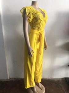 Side view of elegant yellow lace patchwork sleeveless jumpsuit featuring a waist tie detail