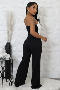Detail view of contrast black and white strapless jumpsuit with wide-leg silhouette