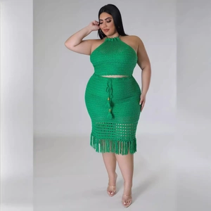 Women's plus size two-piece crochet set with halter top and green fringe skirt