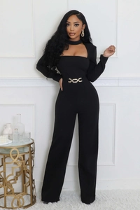 Detail view of black wide-leg jumpsuit with cutout neckline and golden chain belt accessory
