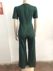 Detailed back view of short sleeve dark green jumpsuit featuring a hidden zipper
