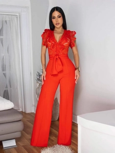 Elegant red lace sleeveless jumpsuit with V-neckline, waist tie belt and wide-leg trousers