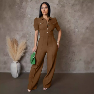 Close-up of deep brown one-piece jumpsuit with metal buttons and cargo pockets