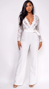 Detailed view of white jumpsuit with crochet lace V-neck bodice and wide-leg trousers