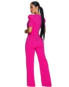 Macro shot of rose pink short-sleeved wide-leg jumpsuit with detailed back seam