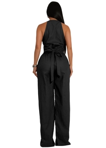 Back view of sleeveless jumpsuit showing halter neck and tie-waist wide-leg pants