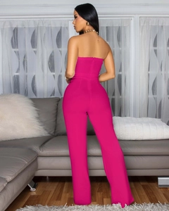 Slim fit hot pink tube top jumpsuit with back zipper detail and straight leg cut