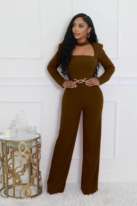 Detail view of brown wide-leg jumpsuit with cutout neckline and gold chain belt