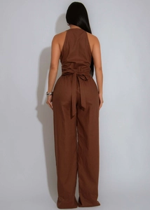 Detail of brown sleeveless wide-leg jumpsuit with waist tie and back halter design