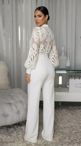 Detailed close-up of white lace embroidery and semi-high collar on the long sleeve jumpsuit