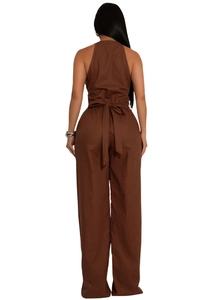 Detail of cross-back tie and waist bow on dark brown sleeveless sports jumpsuit